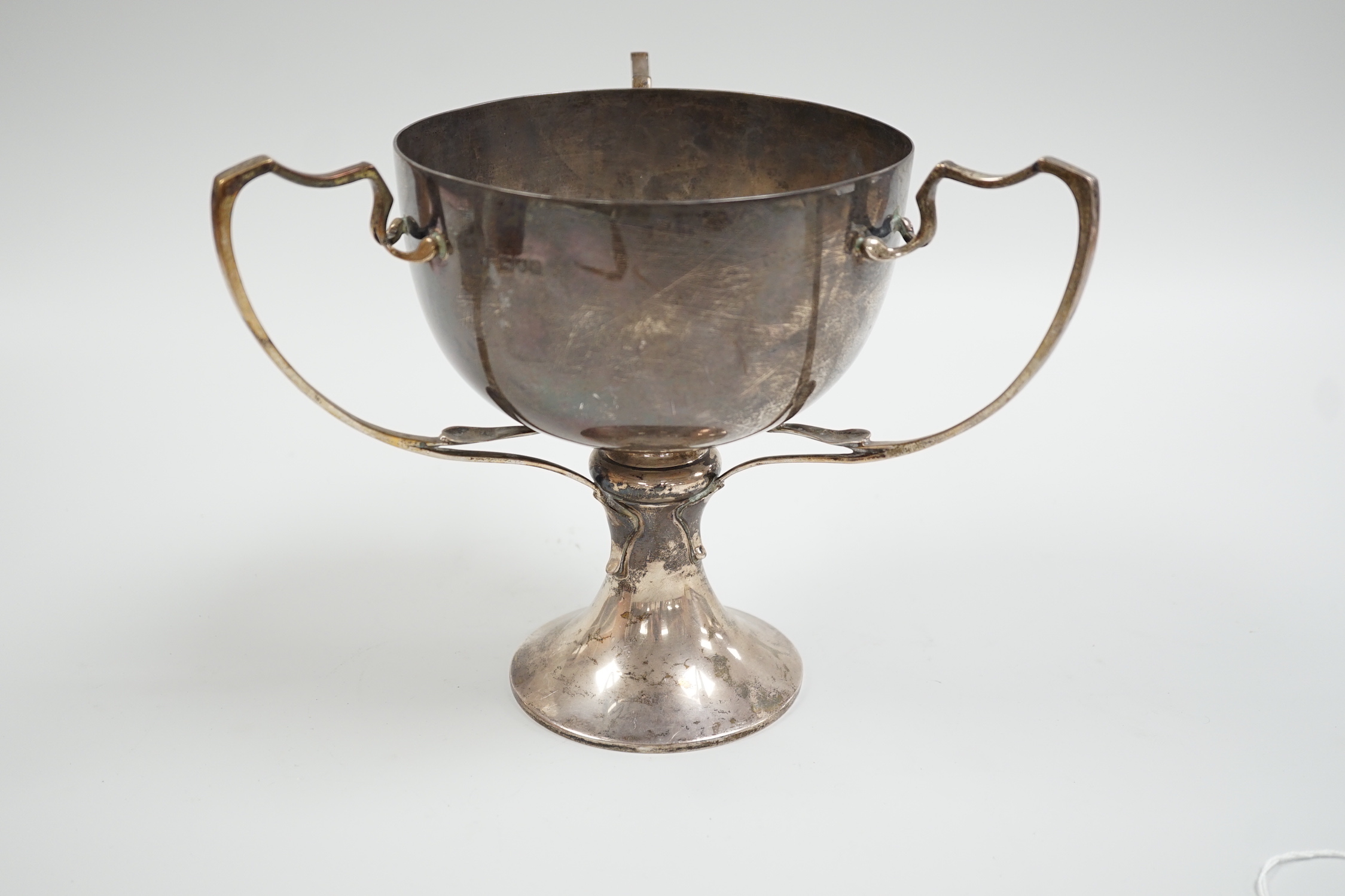 A George V silver tri-handled presentation cup, with engraved inscription, Charles Boyton & Son Ltd, London, 1912, height 19.6cm, 26.5oz.